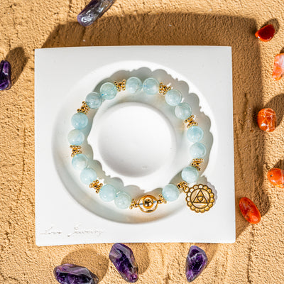 Crystelling Aquamarine Bracelet with Golden Throat Chakra Sign