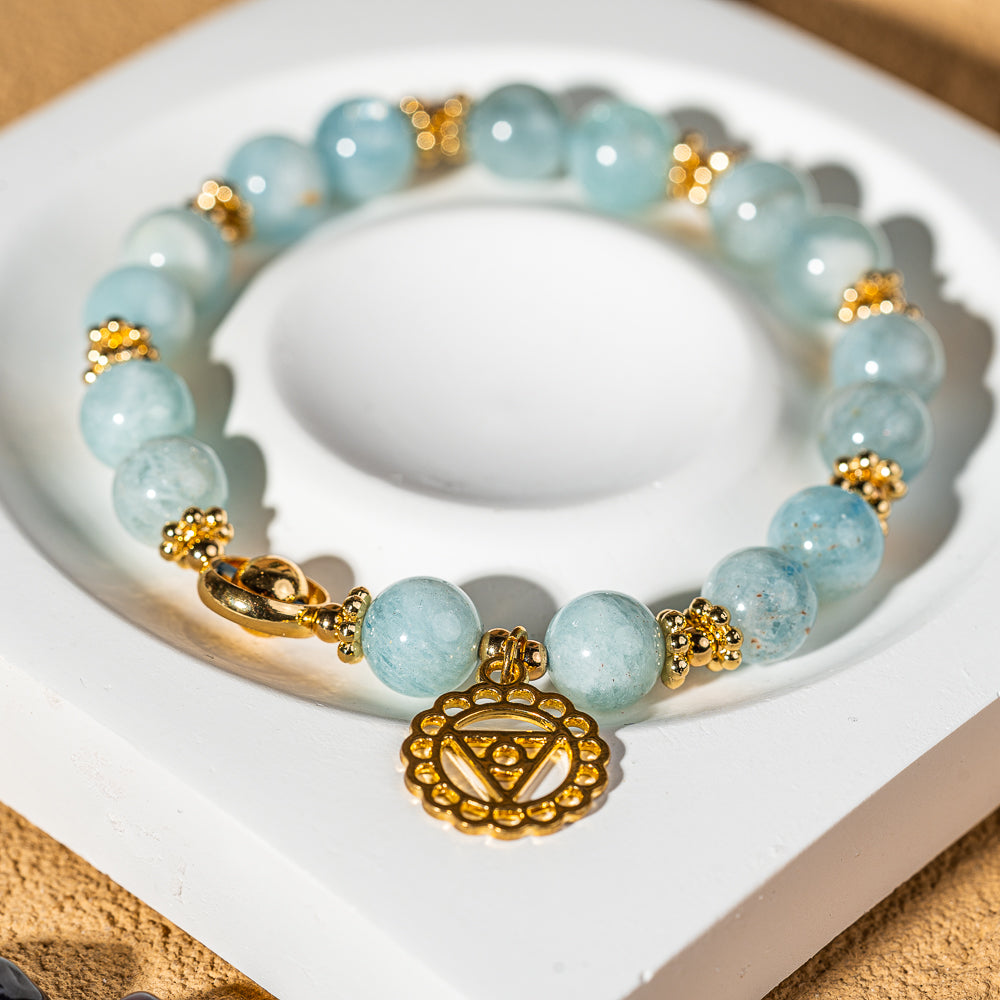 Crystelling Aquamarine Bracelet with Golden Throat Chakra Sign