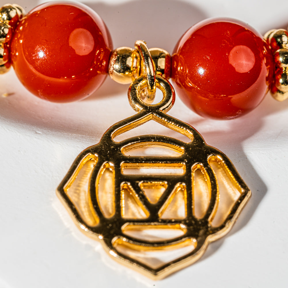 Crystelling Carnelian Bracelet with Root Chakra Sign